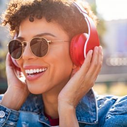 happy-african-woman-with-headphones-XHYEV5W